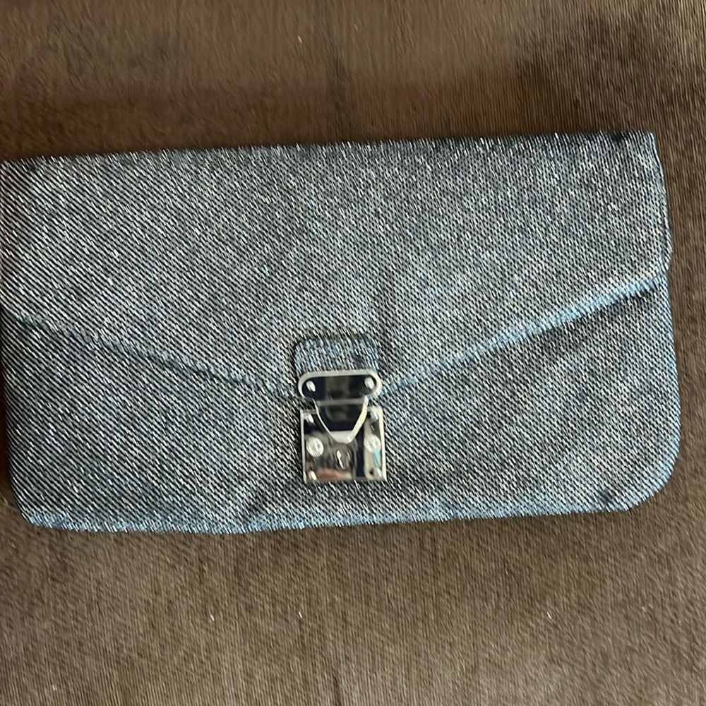 Silver & Black clutch purse,(2) slot openings inside,(1) opening on backside